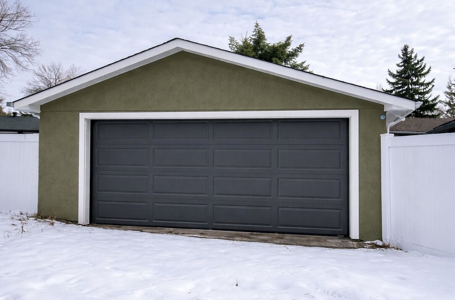 Finished charcoal double garage door installed in Regina